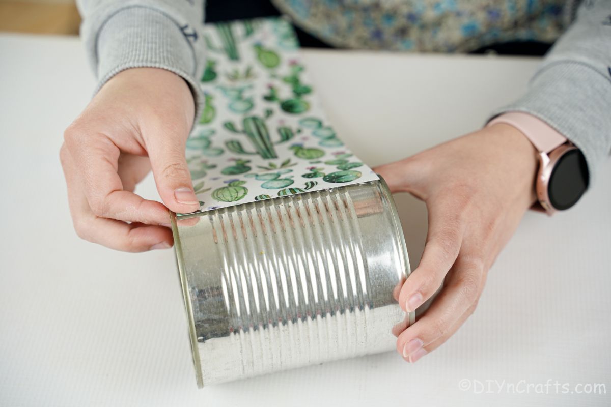 cactus paper being wrapped around tin can