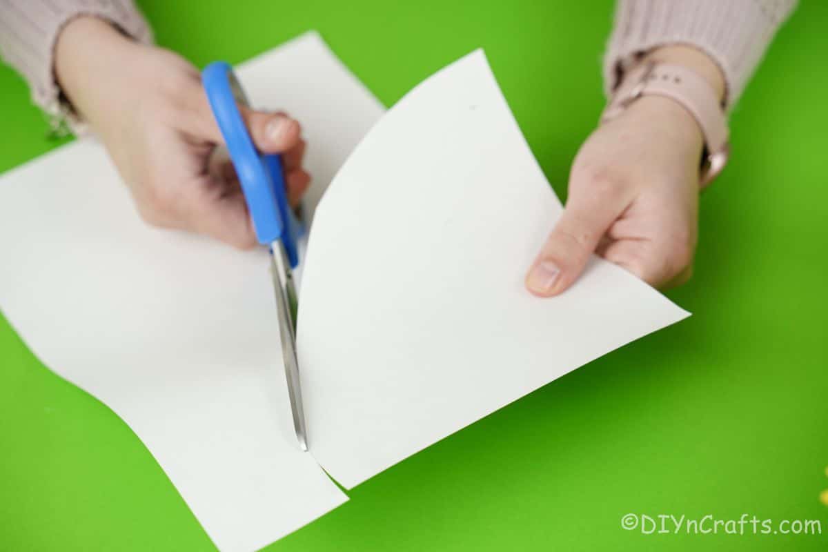 hand cutting white paper