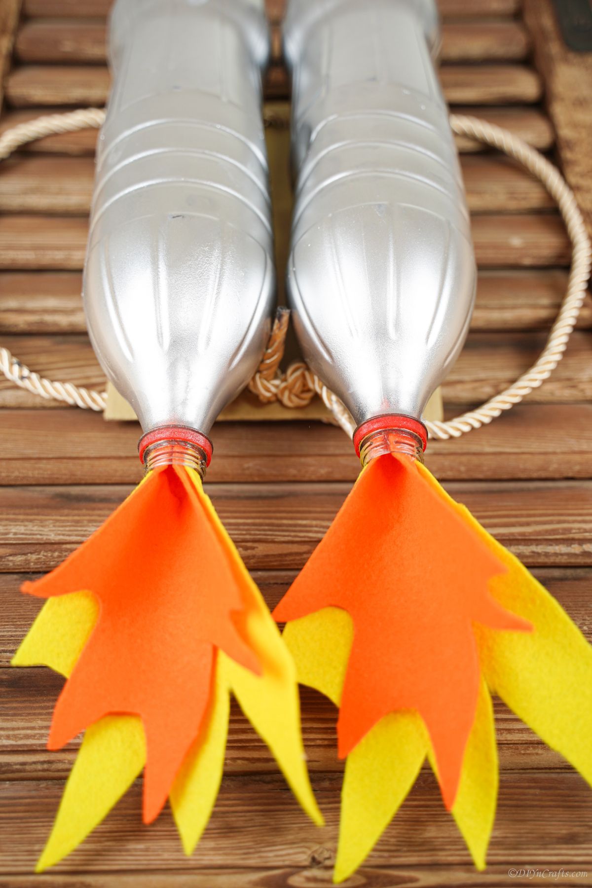 orange and yellow felt flames at the bottom of silver jet pack