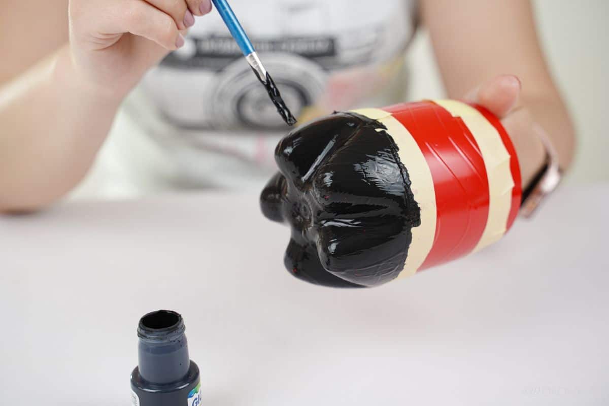 black base being painted onto bottle