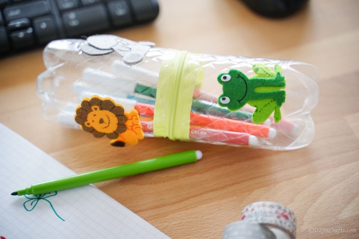 frog and lion stickers on bottle pencil holder