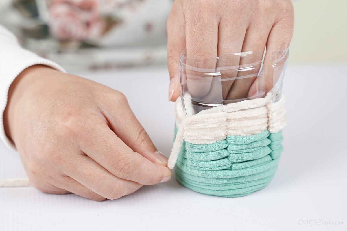 gluing white yarn onto pencil cup