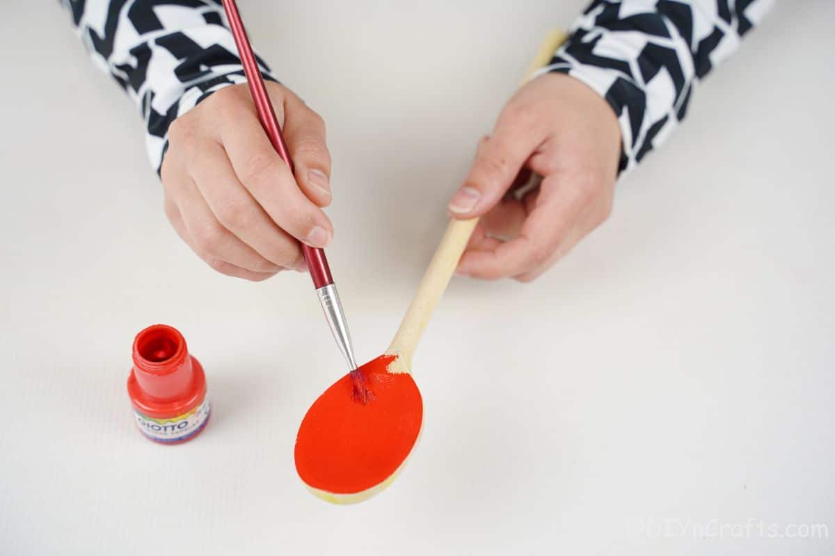 hand painting wooden spoon red