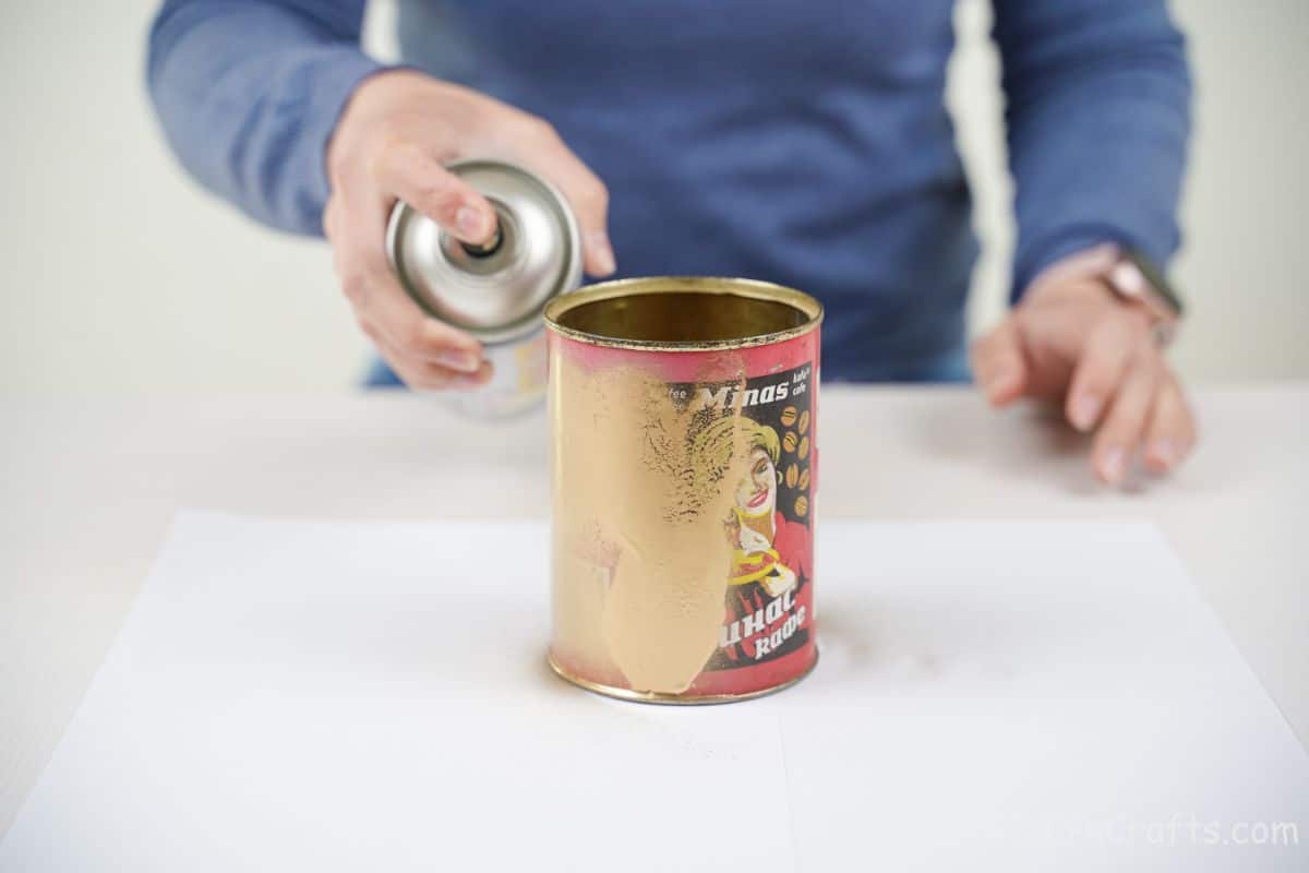 hand spray painting tin can gold