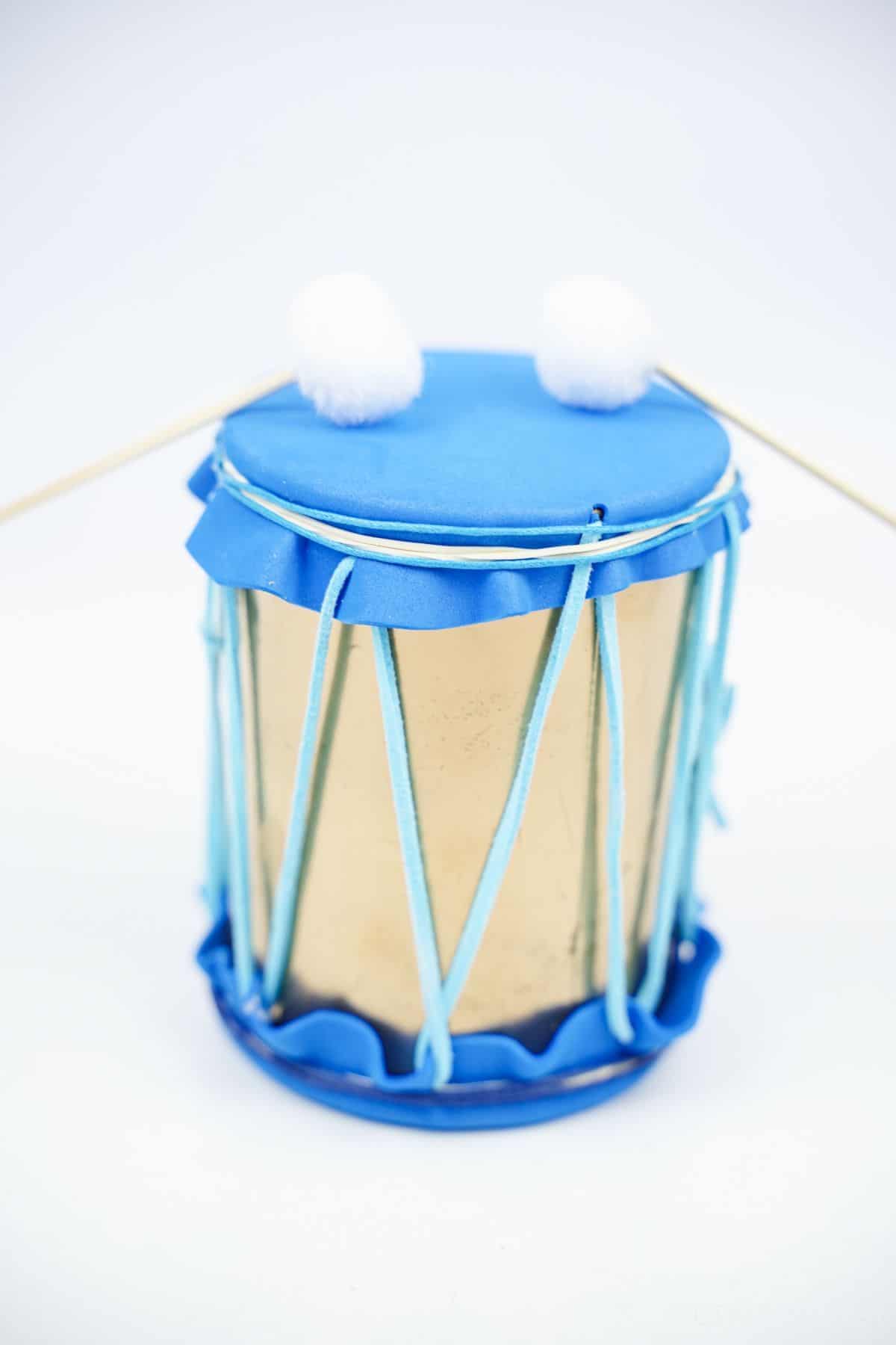 blue and gold mini drum on white table