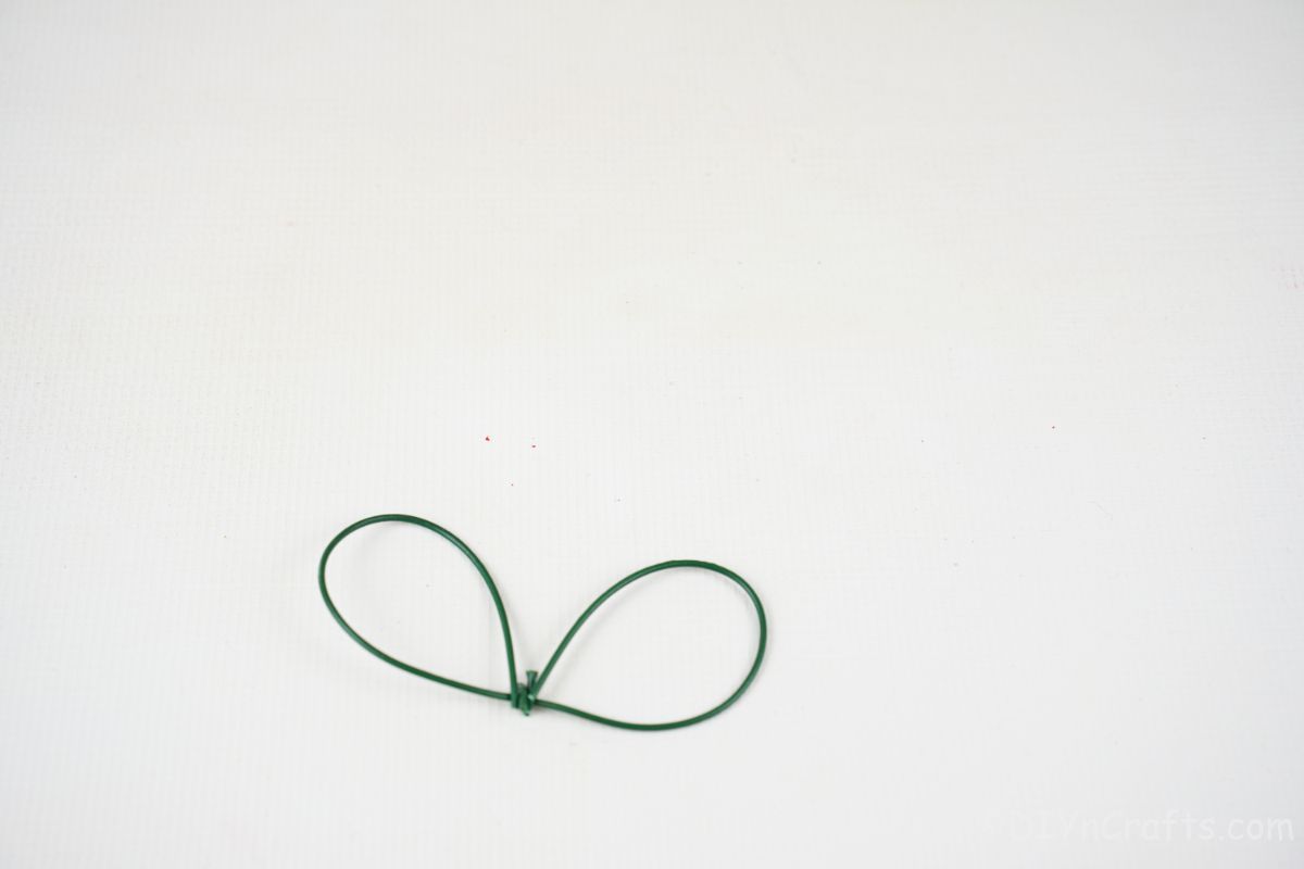 green wire wings on white table