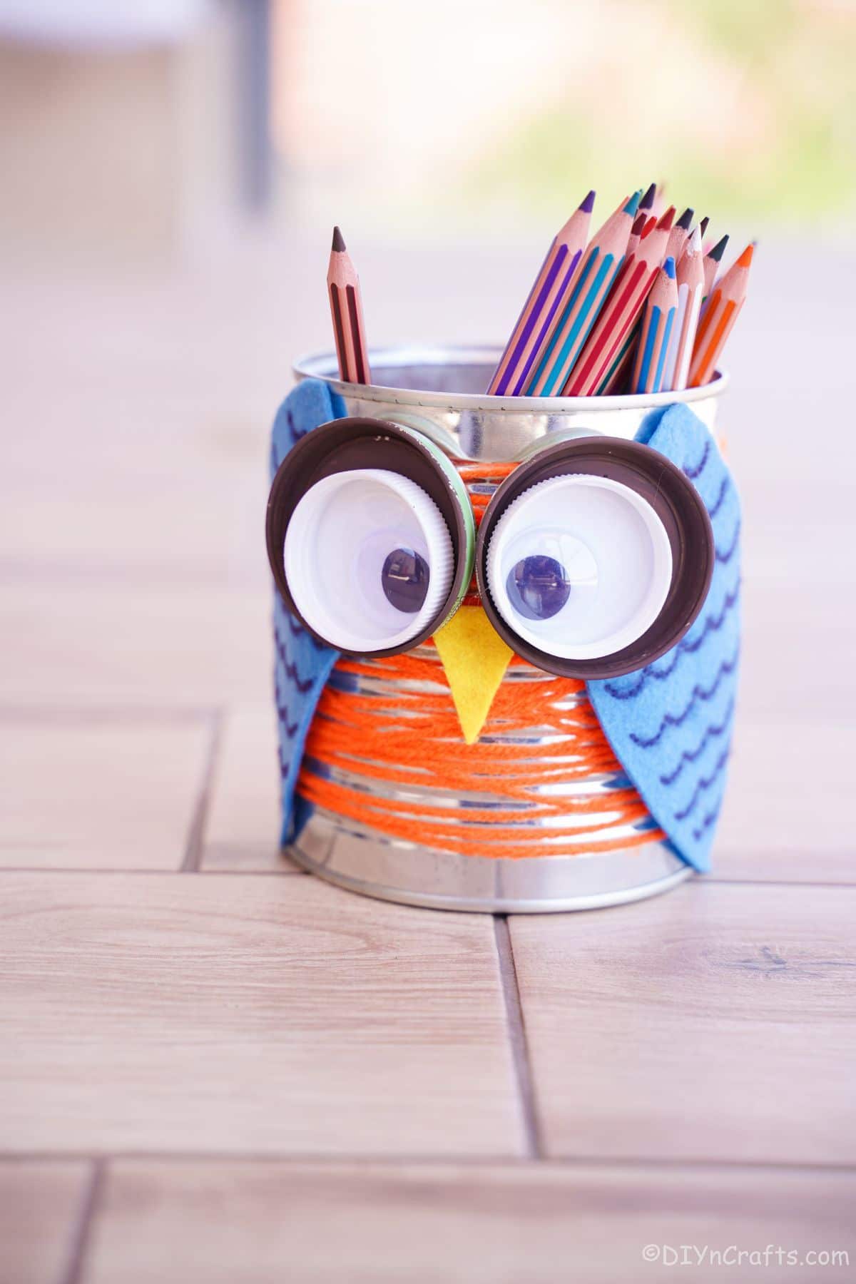 colored pencils in tin can owl