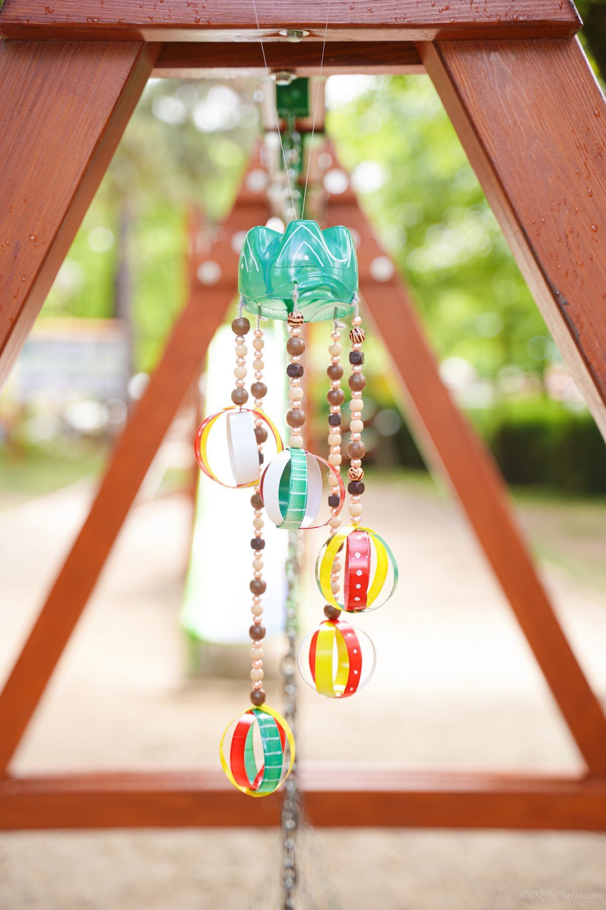 swing set with wind chime on the end