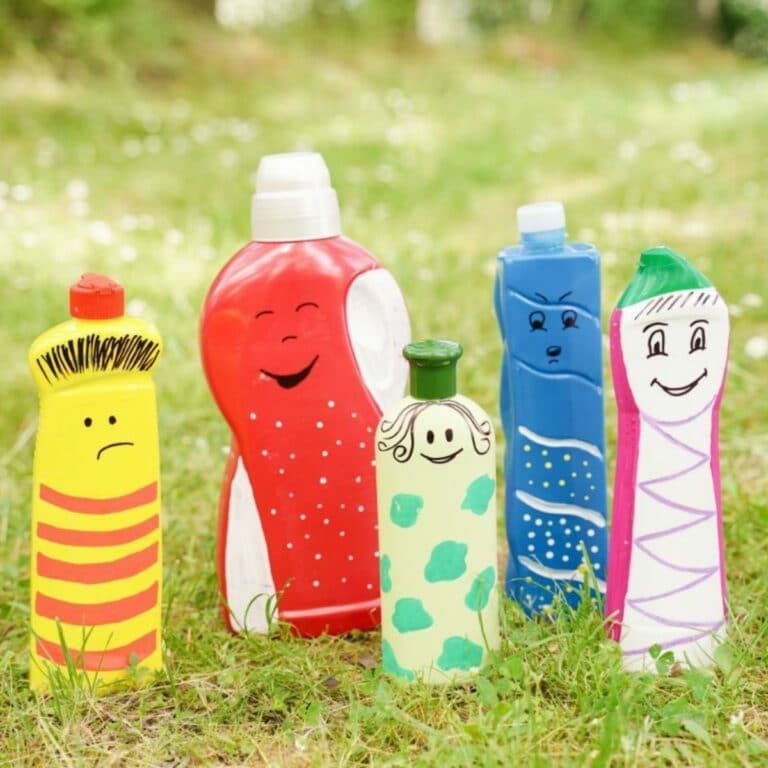 colorful bottle puppets on grass lawn