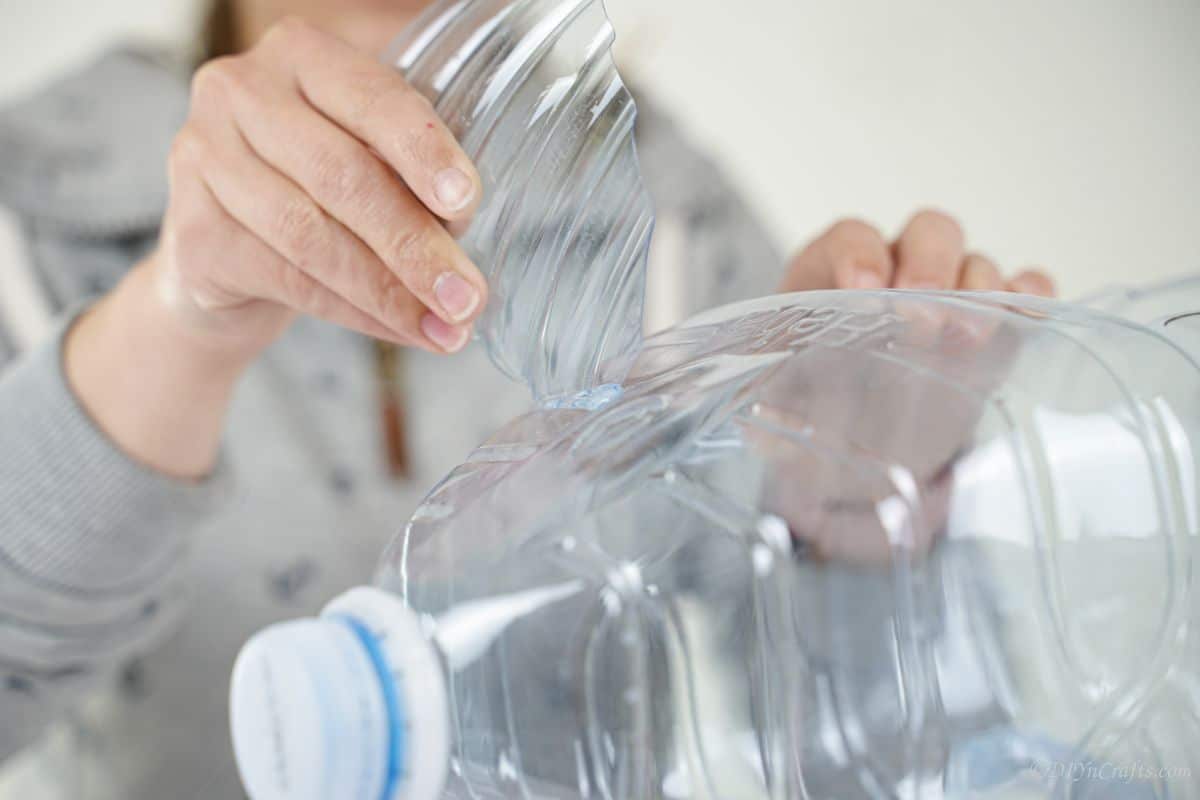 putting ears into plastic bottle piece