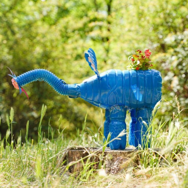 blue elephant planter on a stump