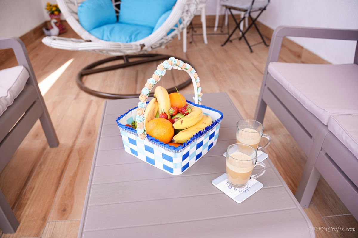 blue and white basket on table filled with fruit