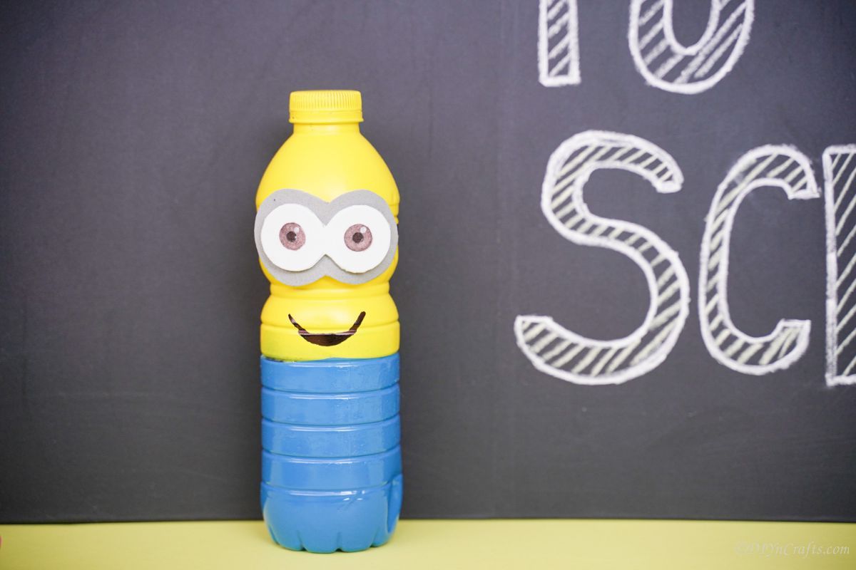 yellow and blue plastic bottle with black background