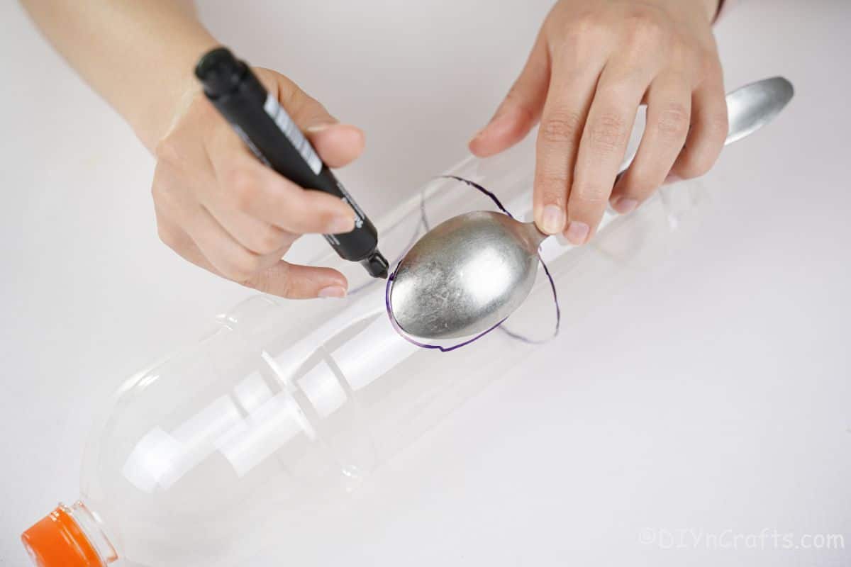 spoon held over bottle to trace