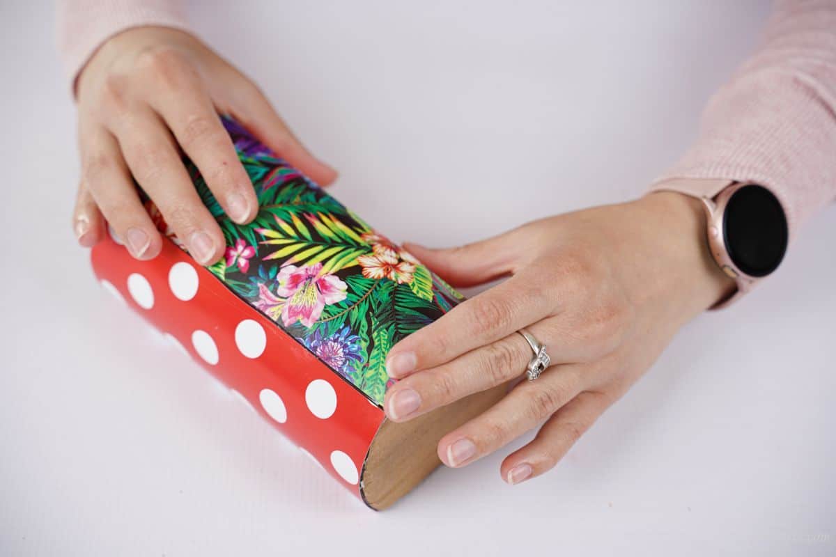 floral paper being added to purse form
