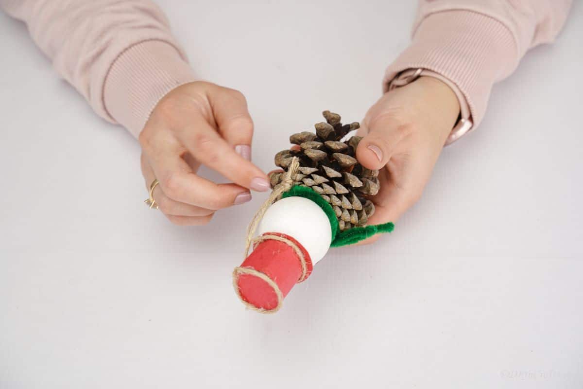 twine being wrapped around ornament