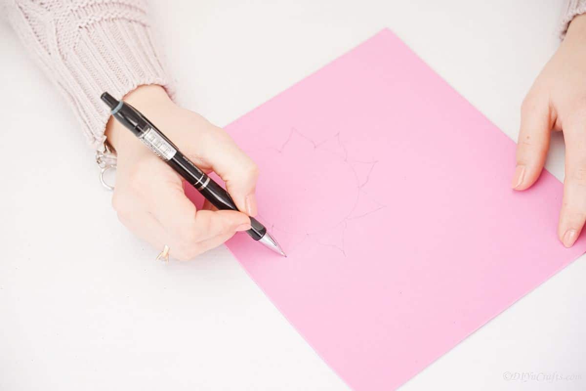 hand drawing flower on pink foam