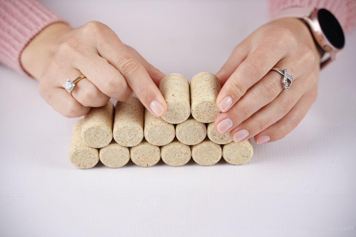 stacking corks on top of each other on white table