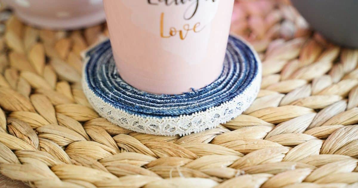 denim coaster holding pink cup on top of jute placemat
