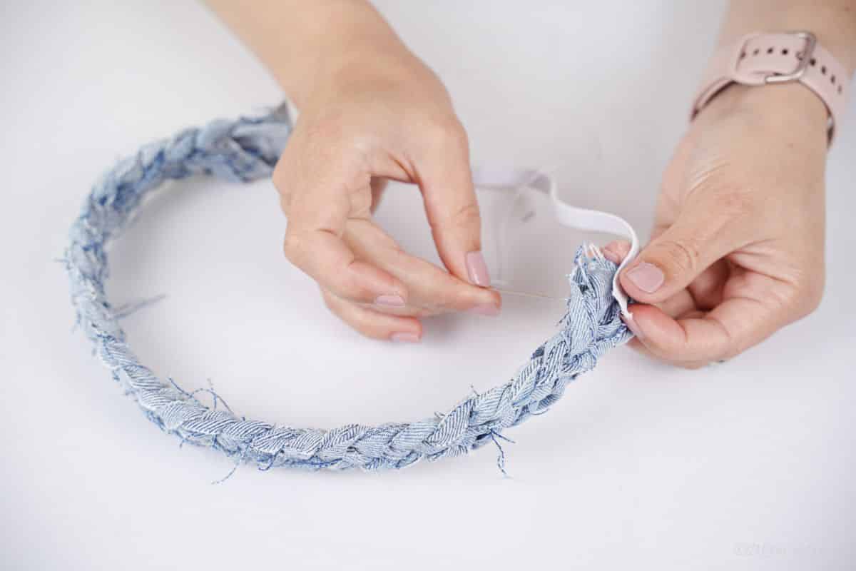 elastic being sewed to both sides of denim headband