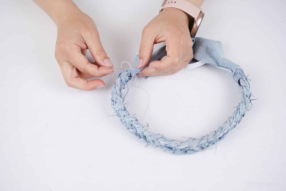 hands holding headband and sewing cover