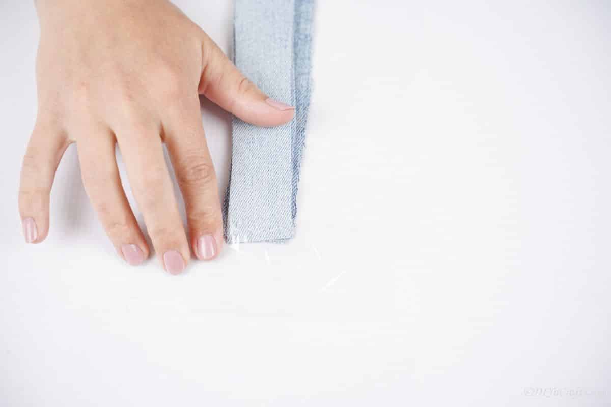 strips of denim laying on table