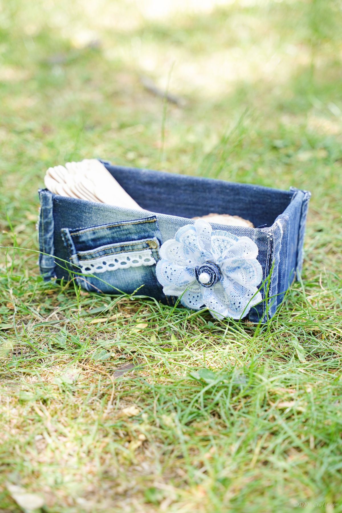 old blue jeans box on grass