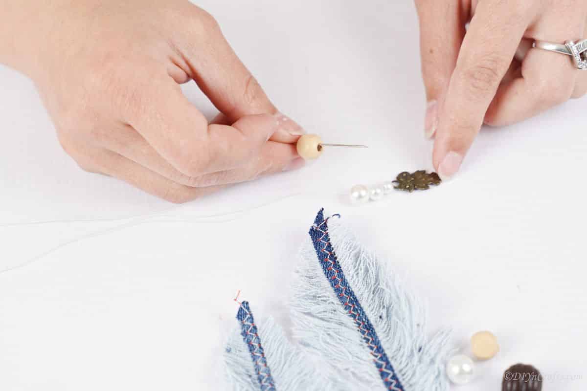 hand string beads onto thread