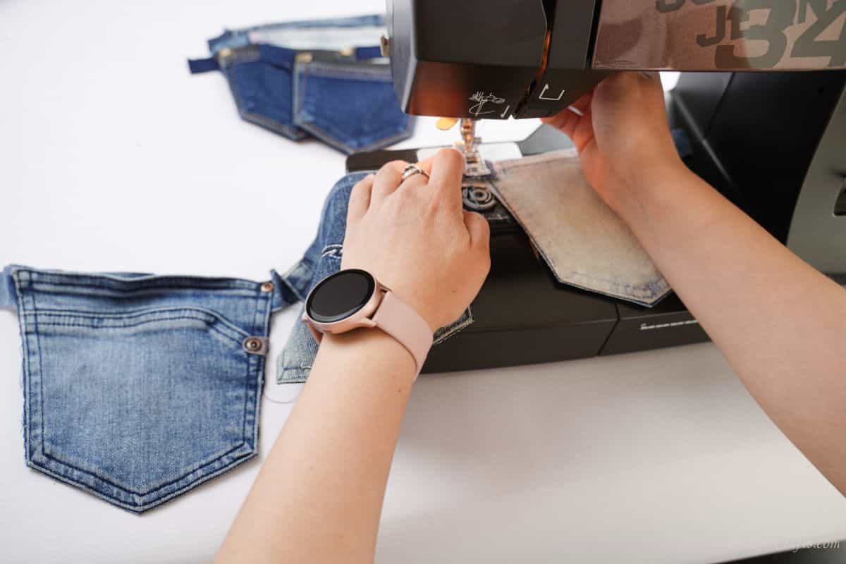 woman using sewing machine to attach pockets to each other