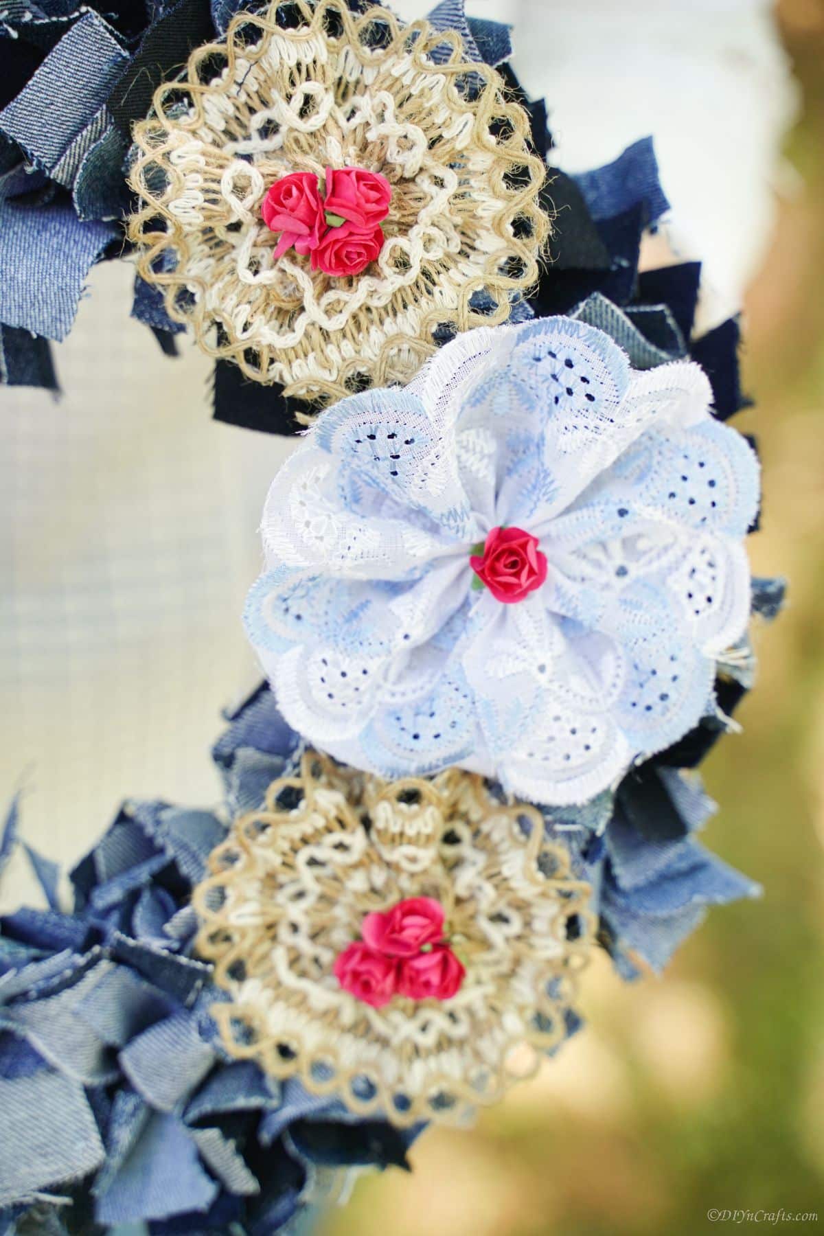 burlap and lace bows on edge of denim wreath