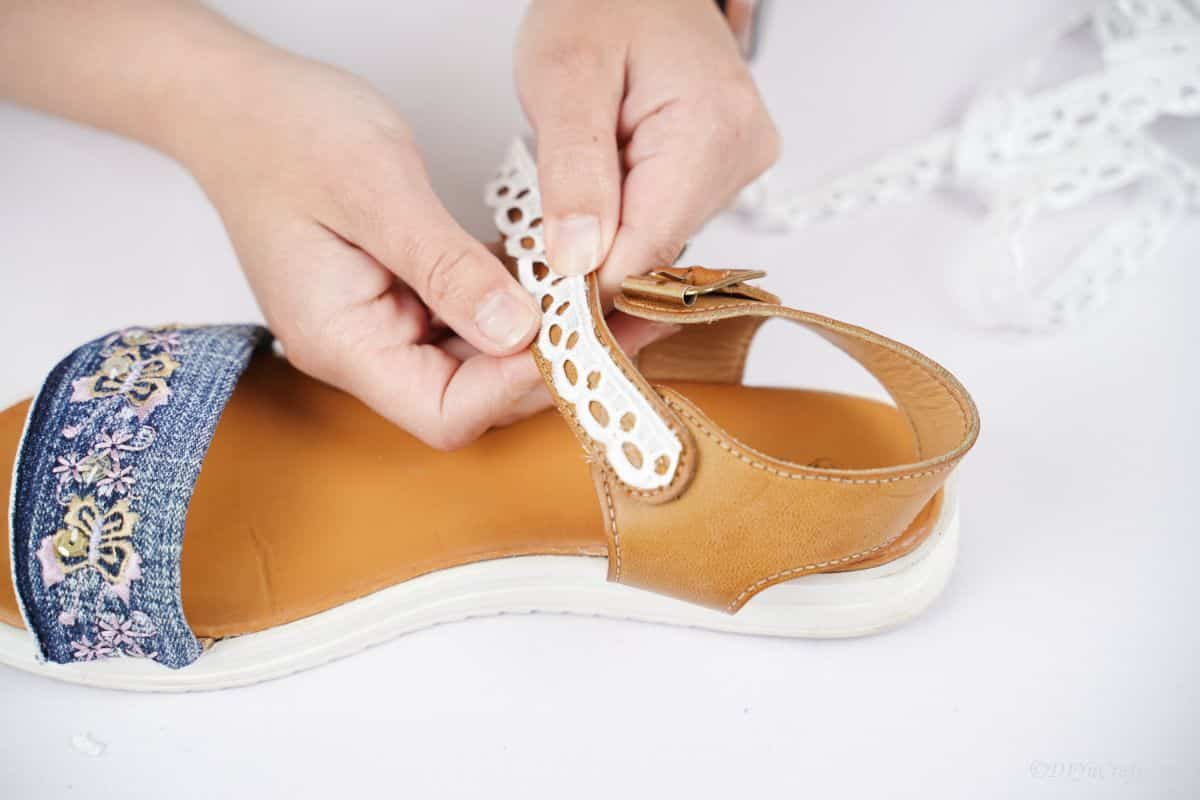 lace being glued onto strap of sandals