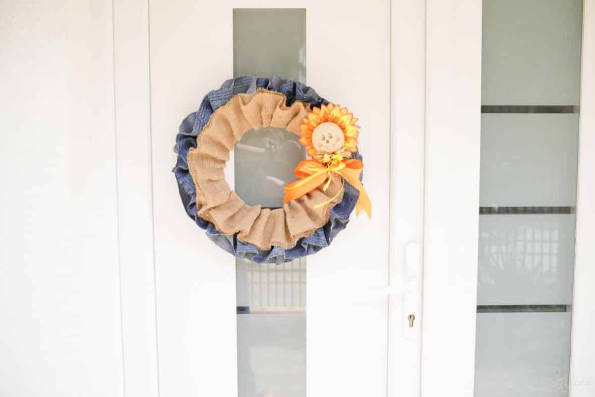 fall wreath on door with glass