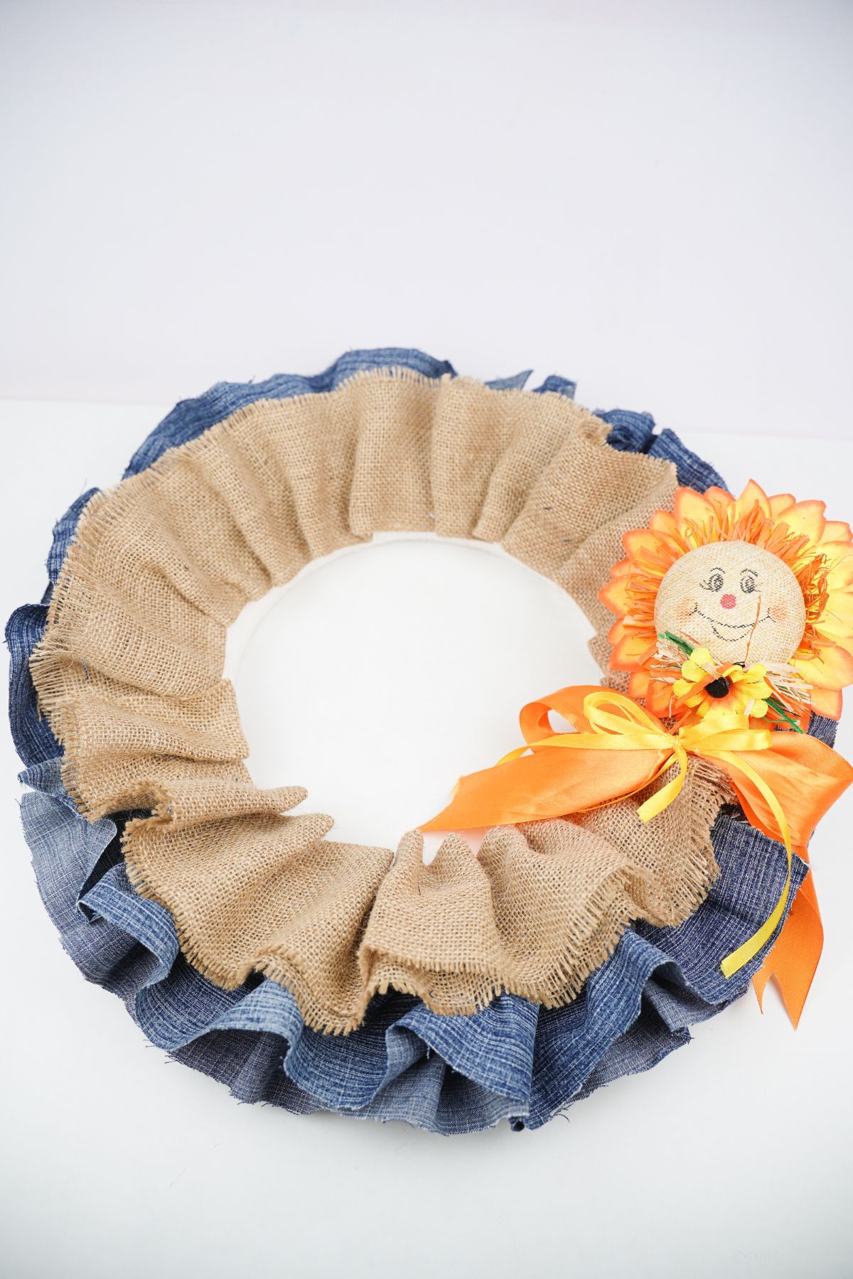 fall wreath laying on white table