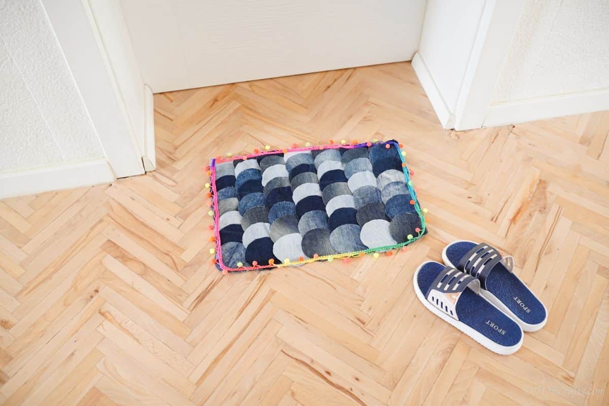 old blue jeans rug on wood floor net to door