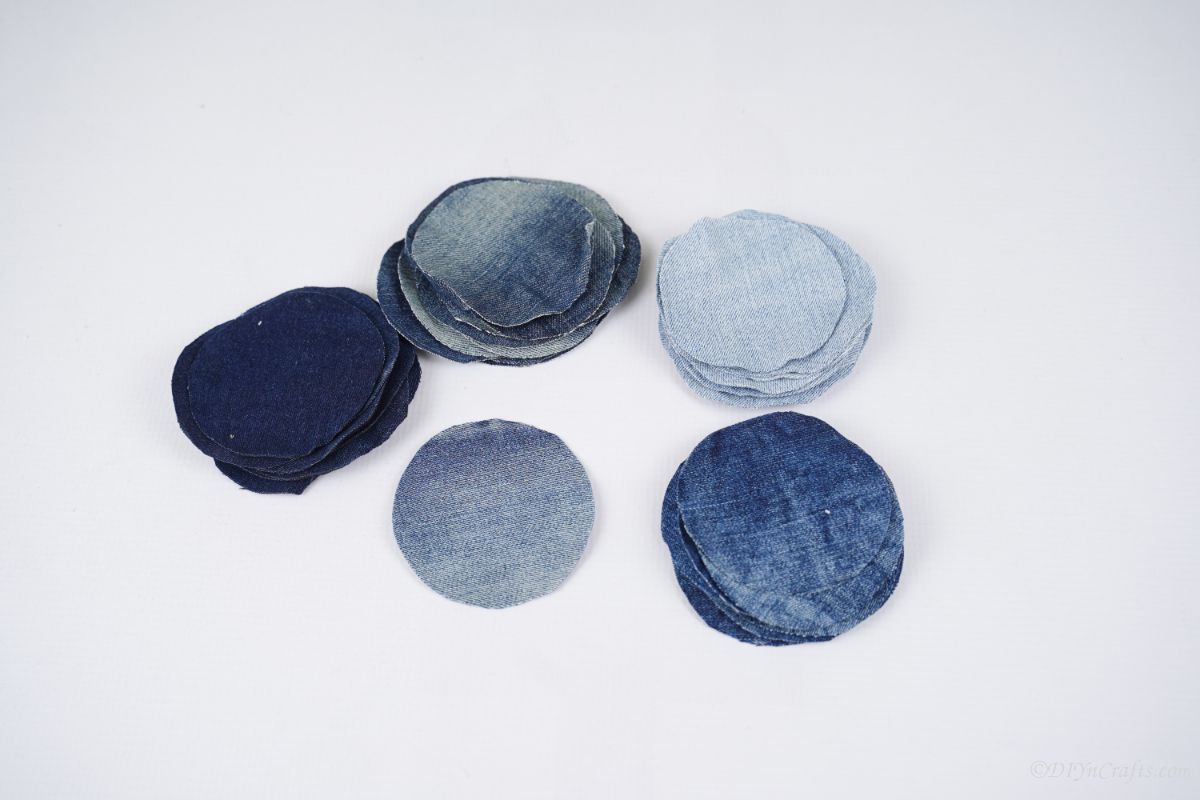 stacks of multiple stains of denim circles on white table