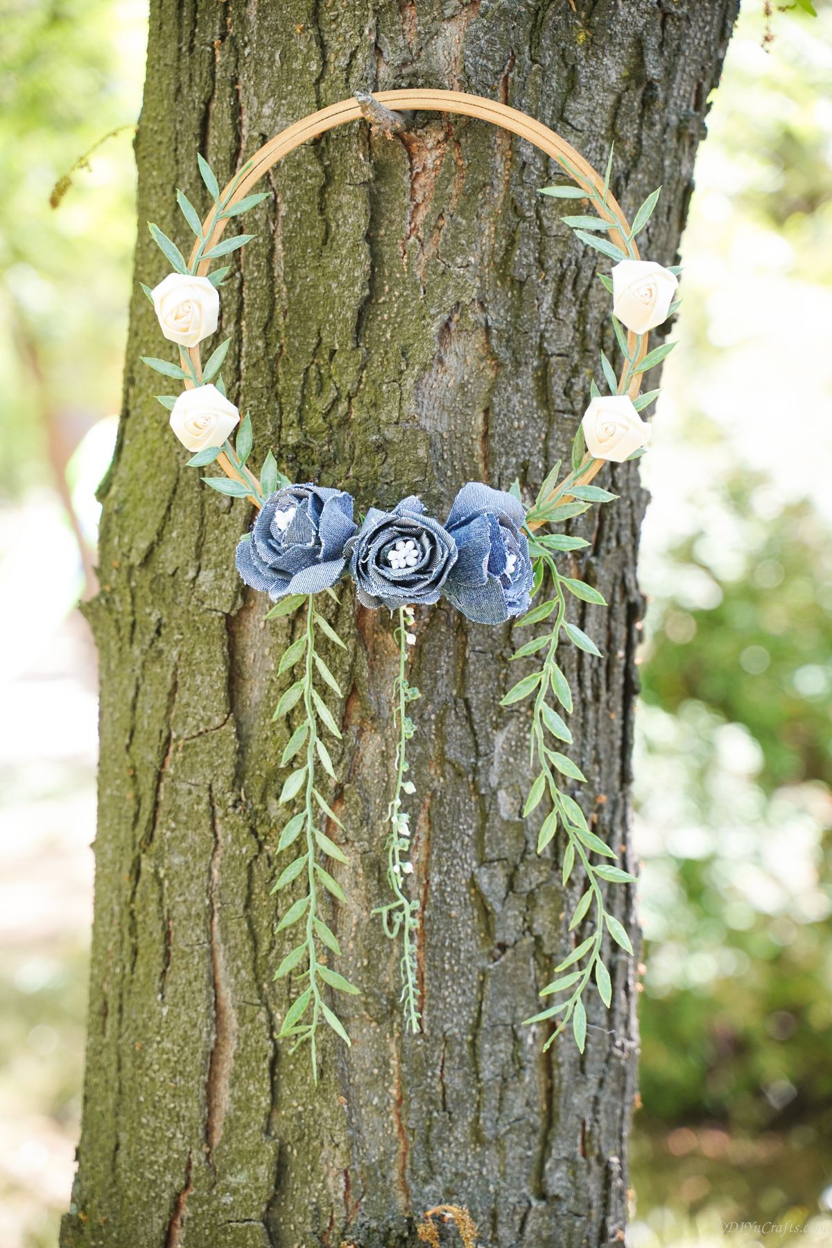 floral wreath hanging on tree