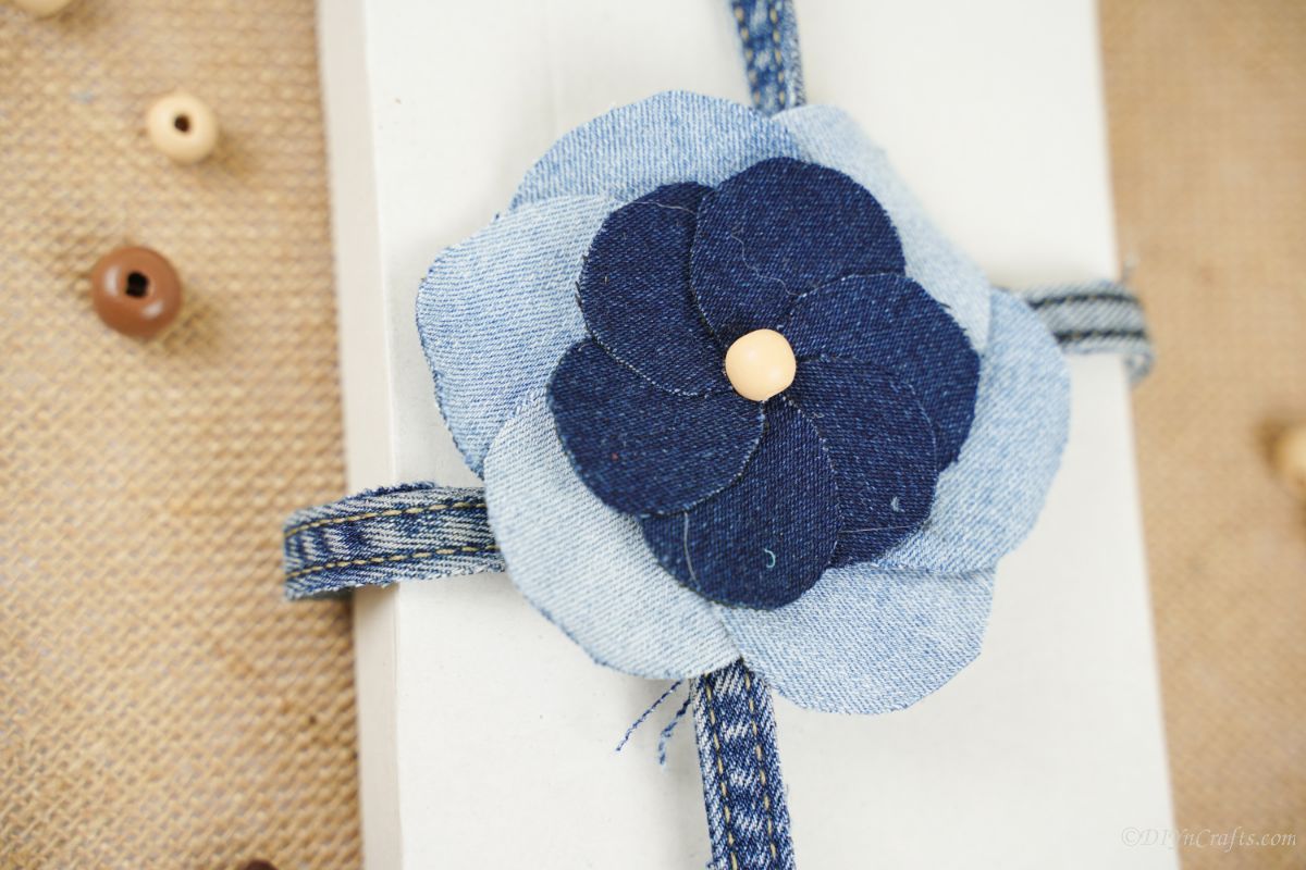 two color denim bow on center of white box