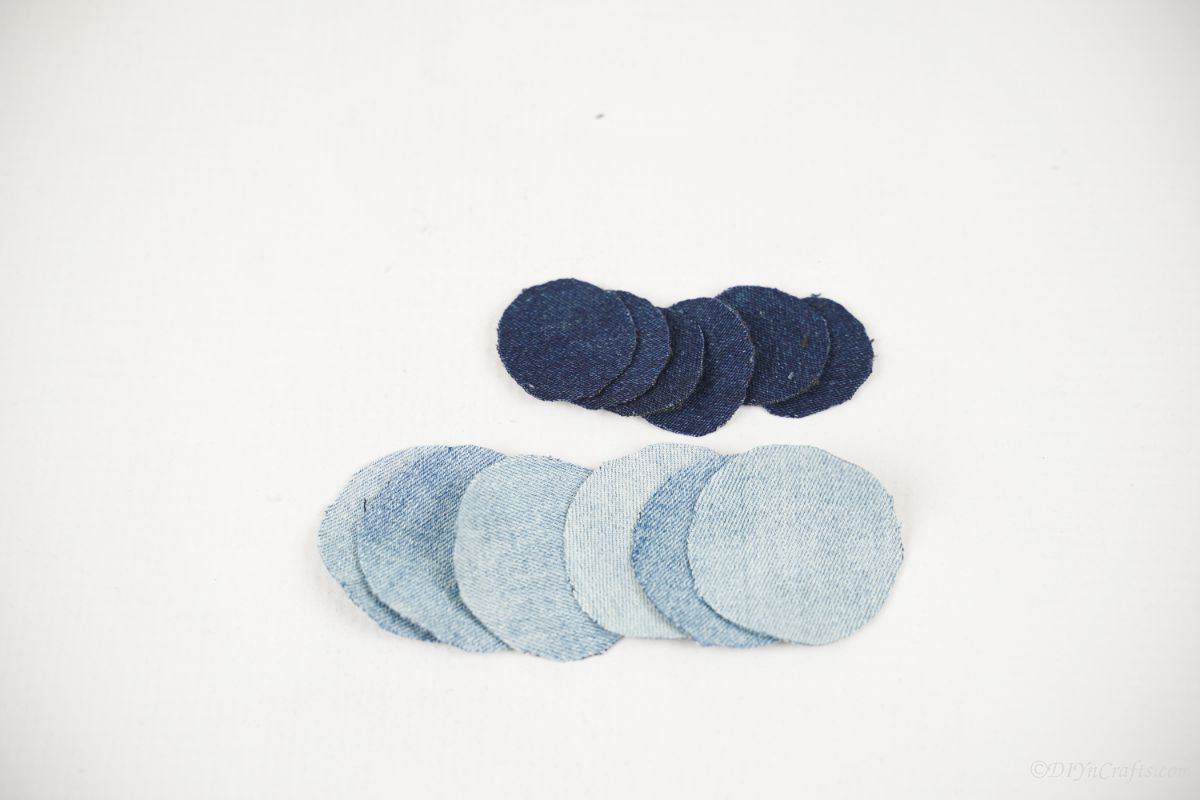 stack of two sizes and colors of denim circles