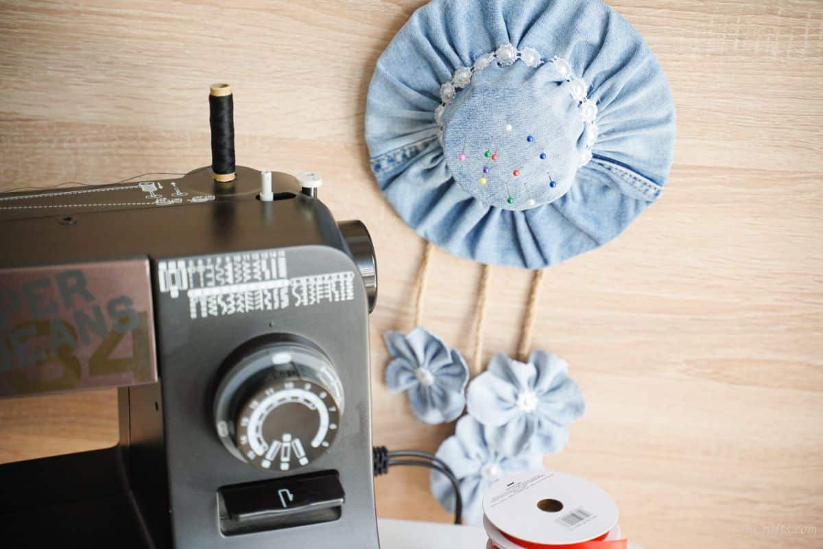 blue jean hat on wall behind sewing machine
