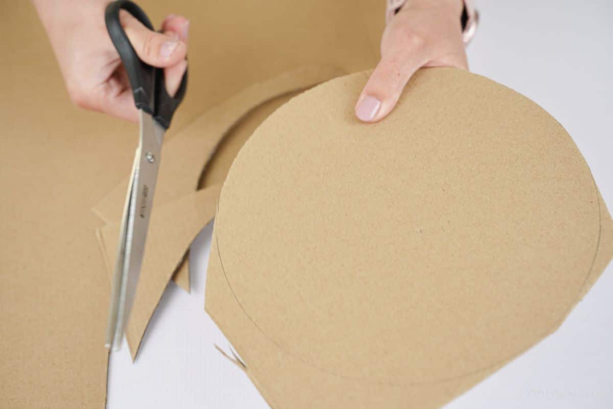 circle of cardboard being cut out