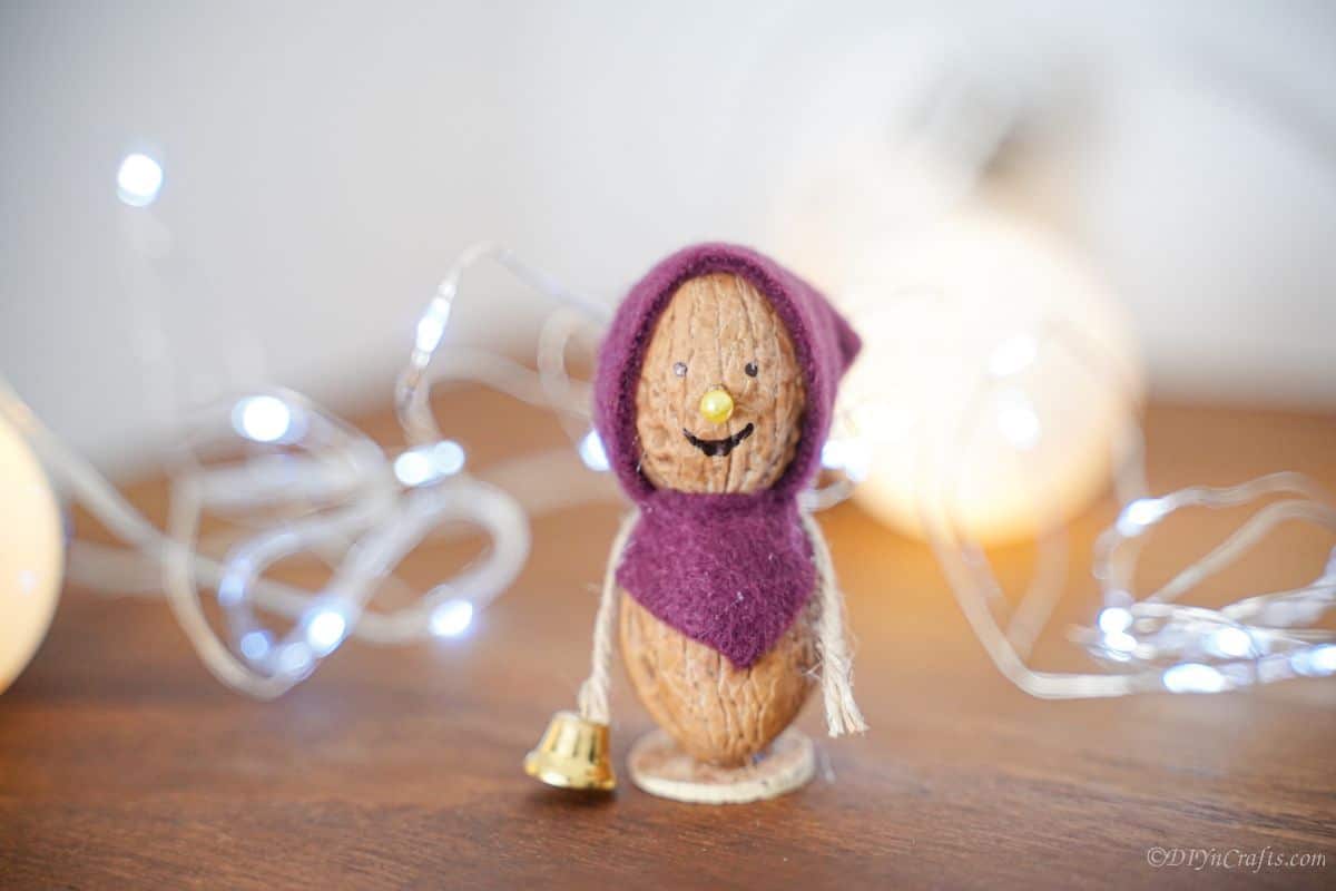 walnut mouse on table with twinkle lights