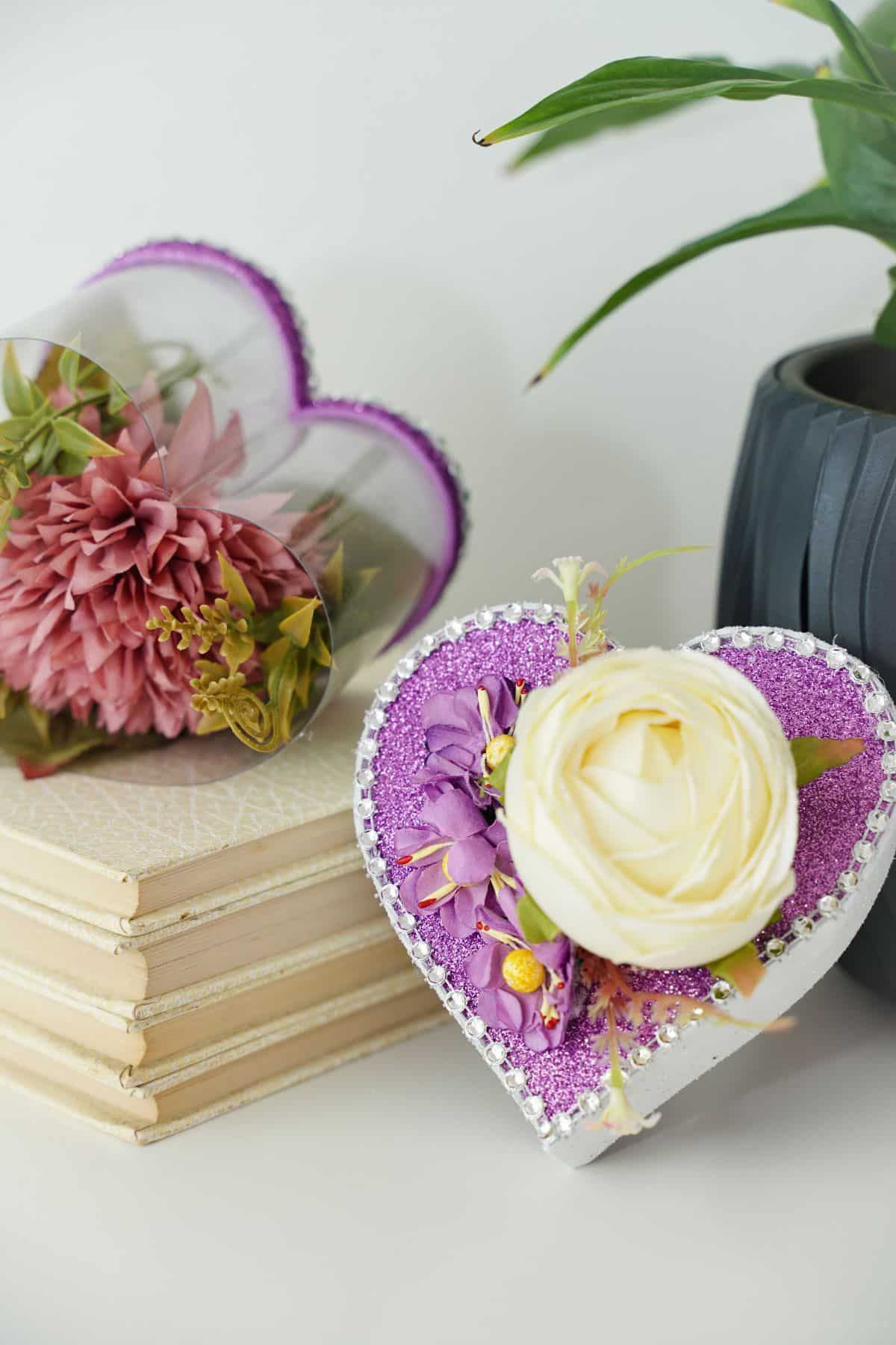 heart box on top of books on table