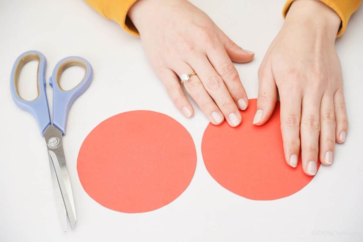 two red paper circles on white table