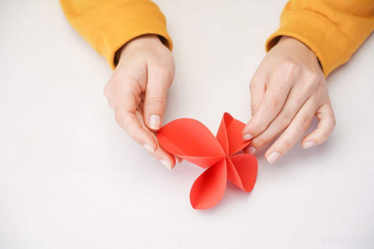 red paper butterfly on white table