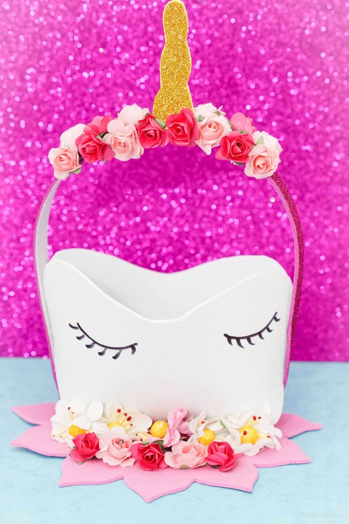 unicorn basket on blue table with pink background