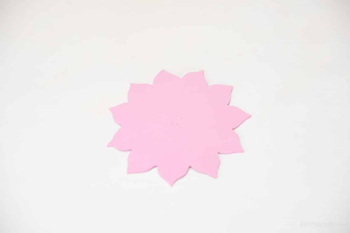 pink foam paper flower on white table