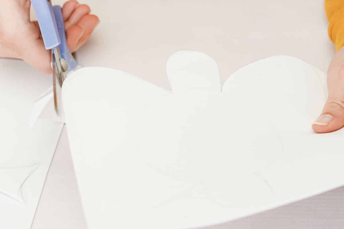 gray scissors cutting white foam paper