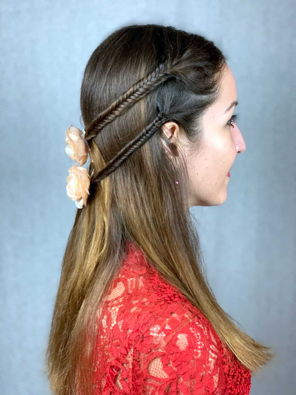 side profile of braided sides of hair on women in red