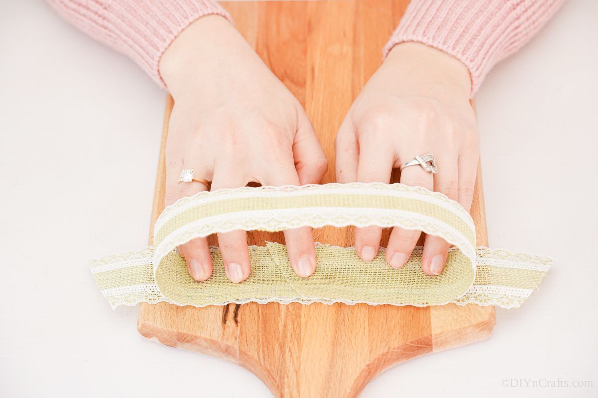 making lace ribbon bow on cutting board