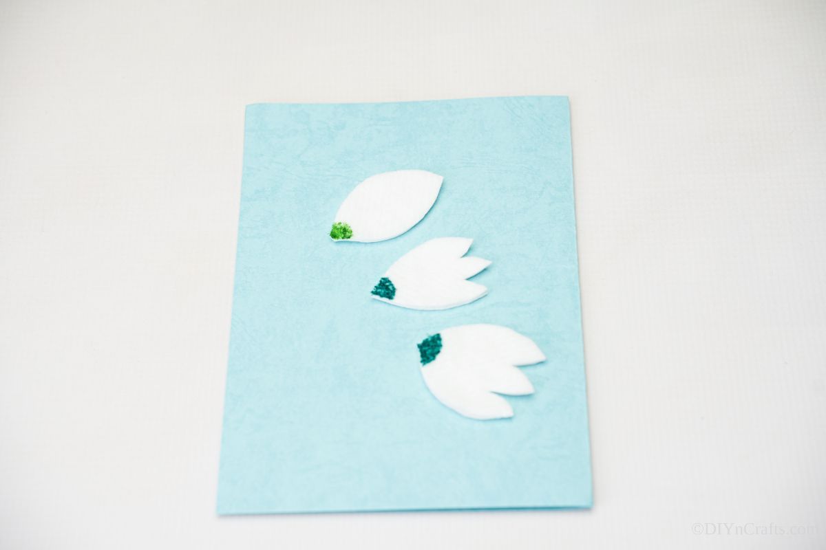 paper tulips on blue card
